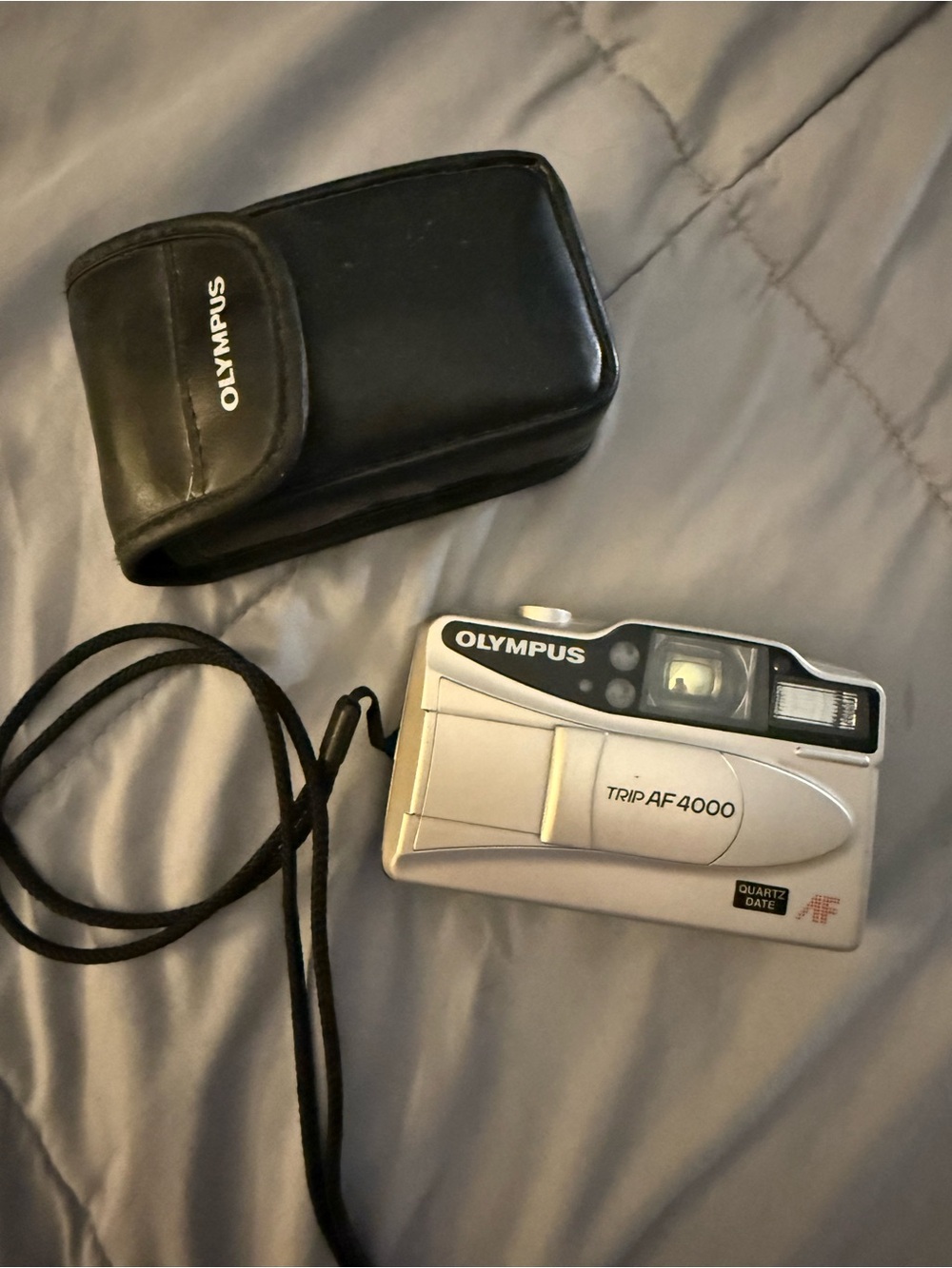 Olympus Silver Compact Point-and-Shoot Film Camera with Black Case